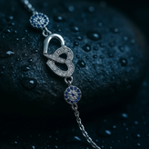 دستبند نقره زنانه طرح دو قلب و چشم نظر